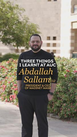 A man is standing in a garden with his hands in his pocket. Text: Three Things I Learnt at AUC, Abdallah Sallam '02 President and CEO of Madinet Masr