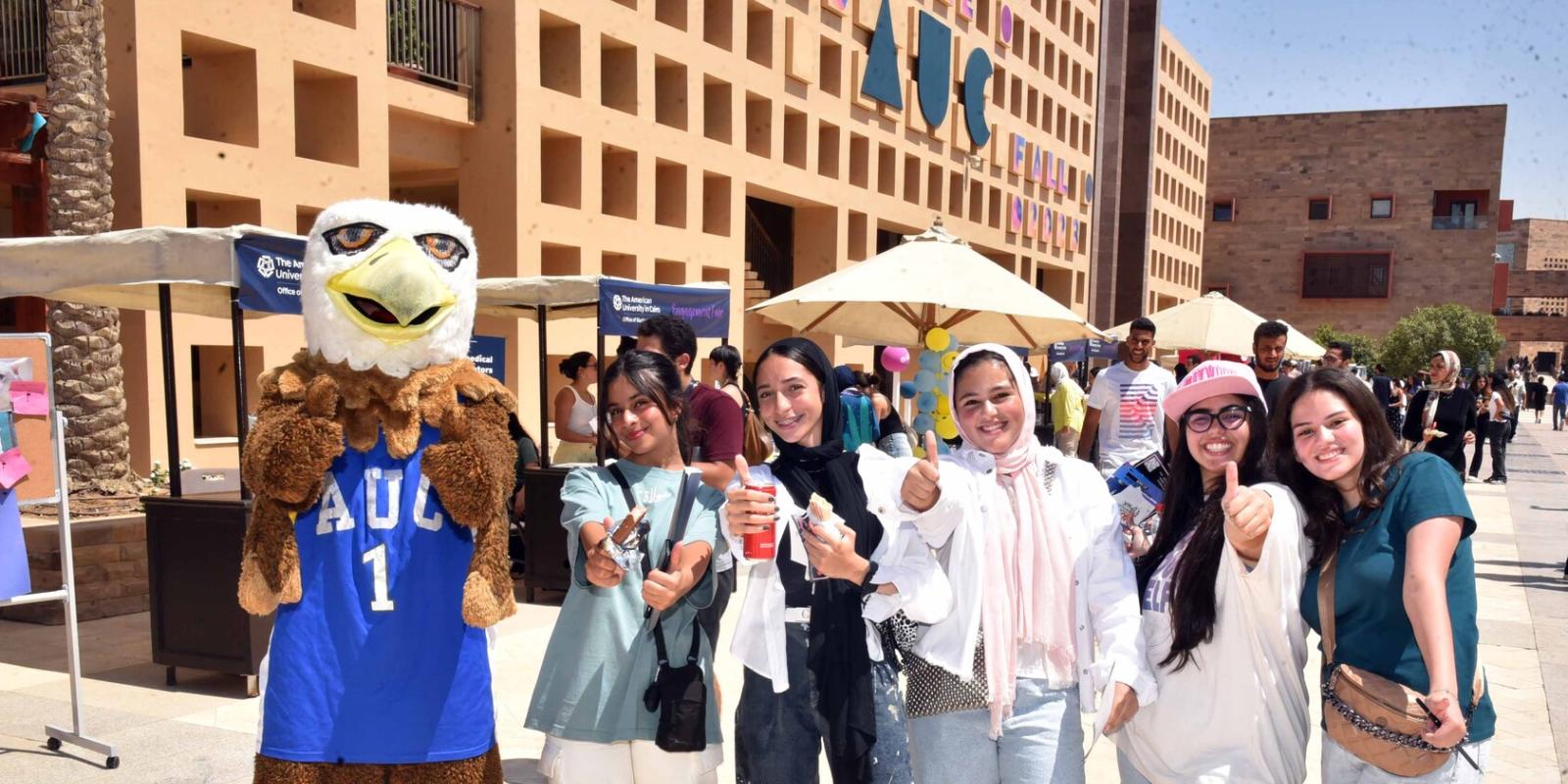 Group of girls standing with an eagle mascot