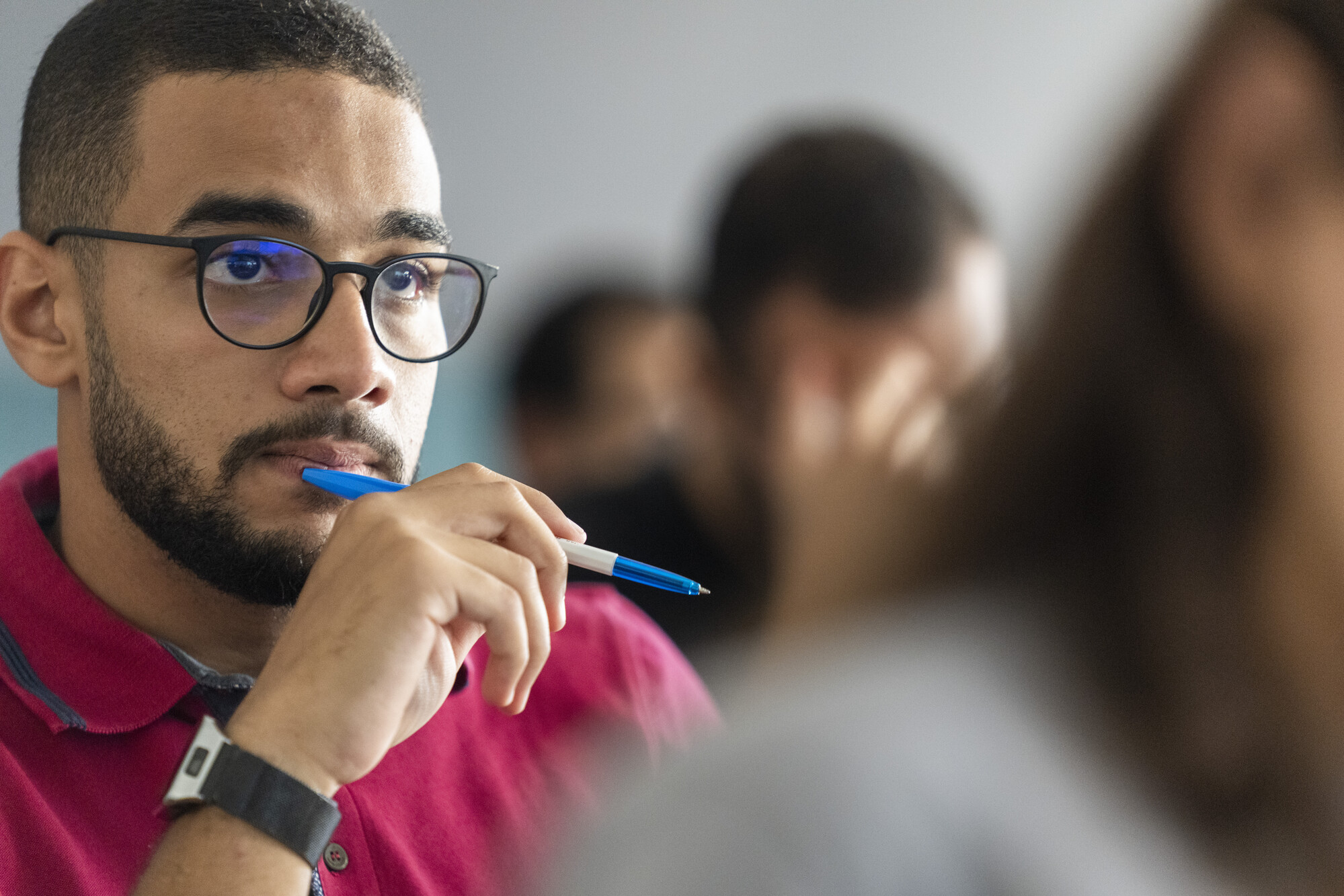 student concentrating in class taking notes