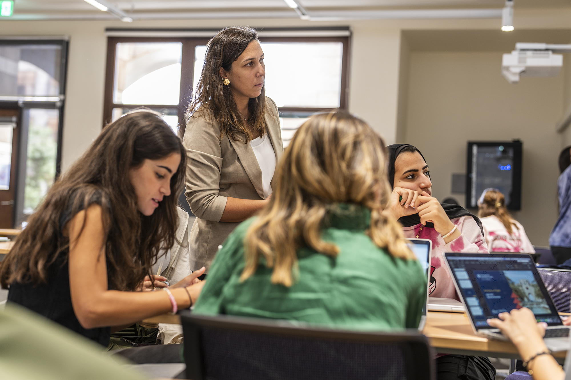 A faculty member giving a lecture in a class