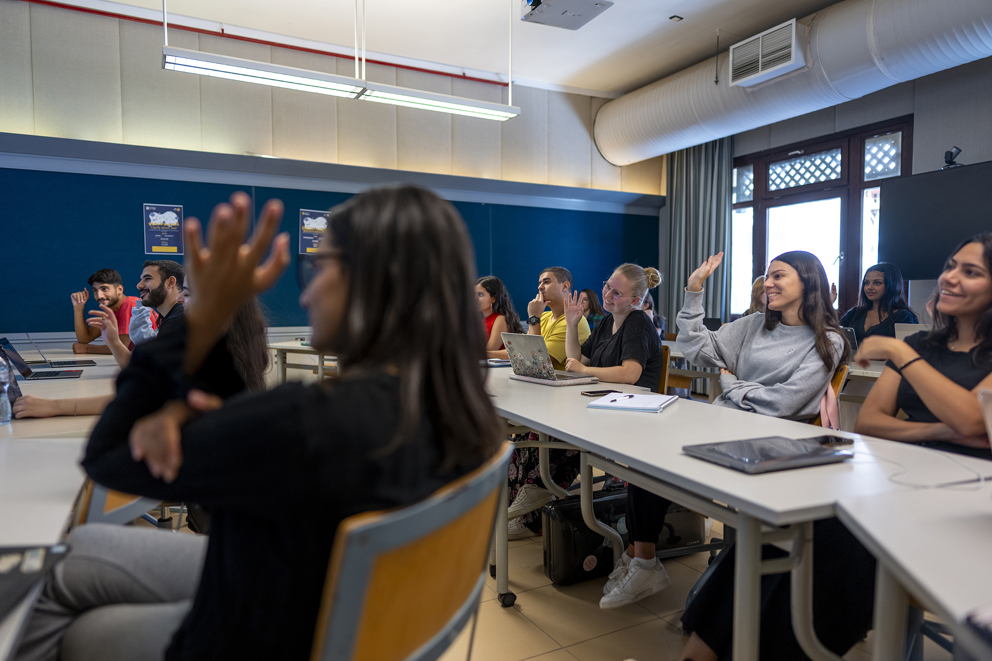 A group of students interacting in a classroom