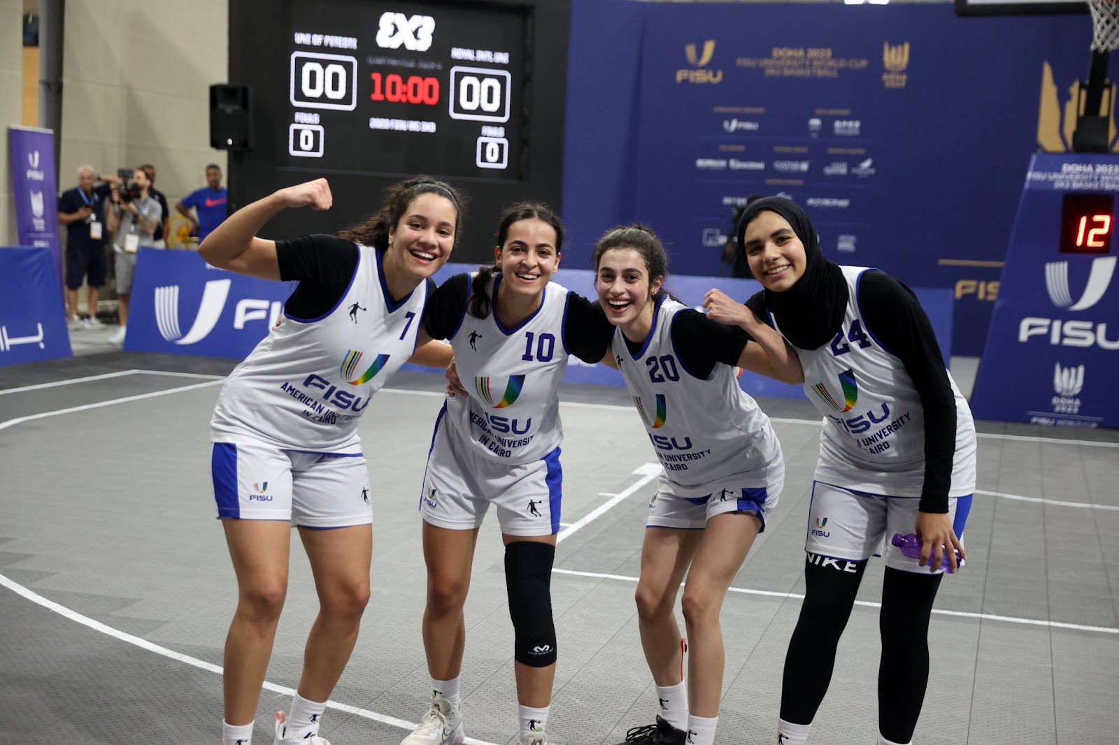 4 women basketball in the field 