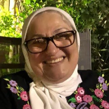 Headshot of a veiled woman smiling