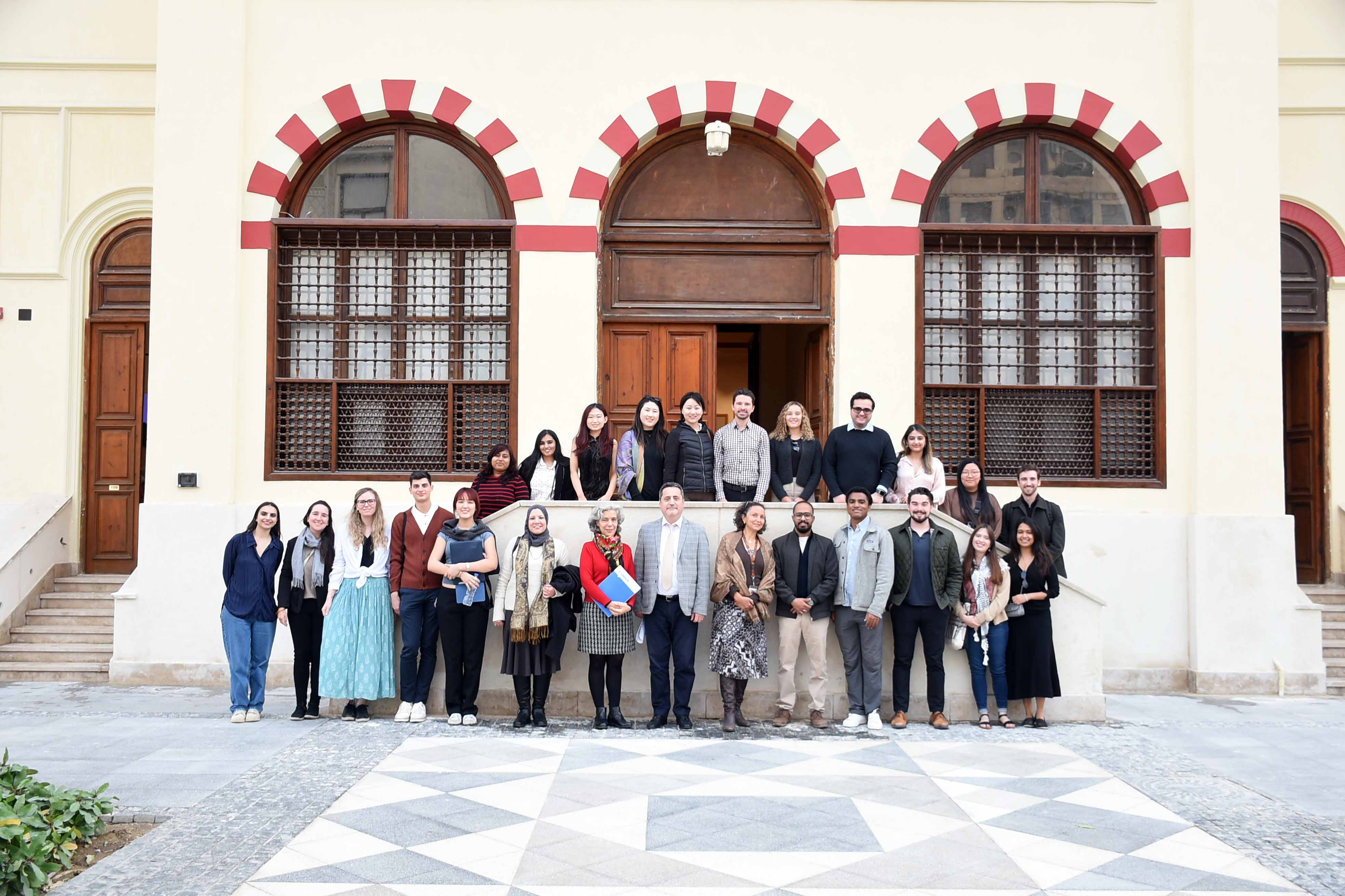 The Columbia cohort poses with AUC faculty in the Tahrir Campus