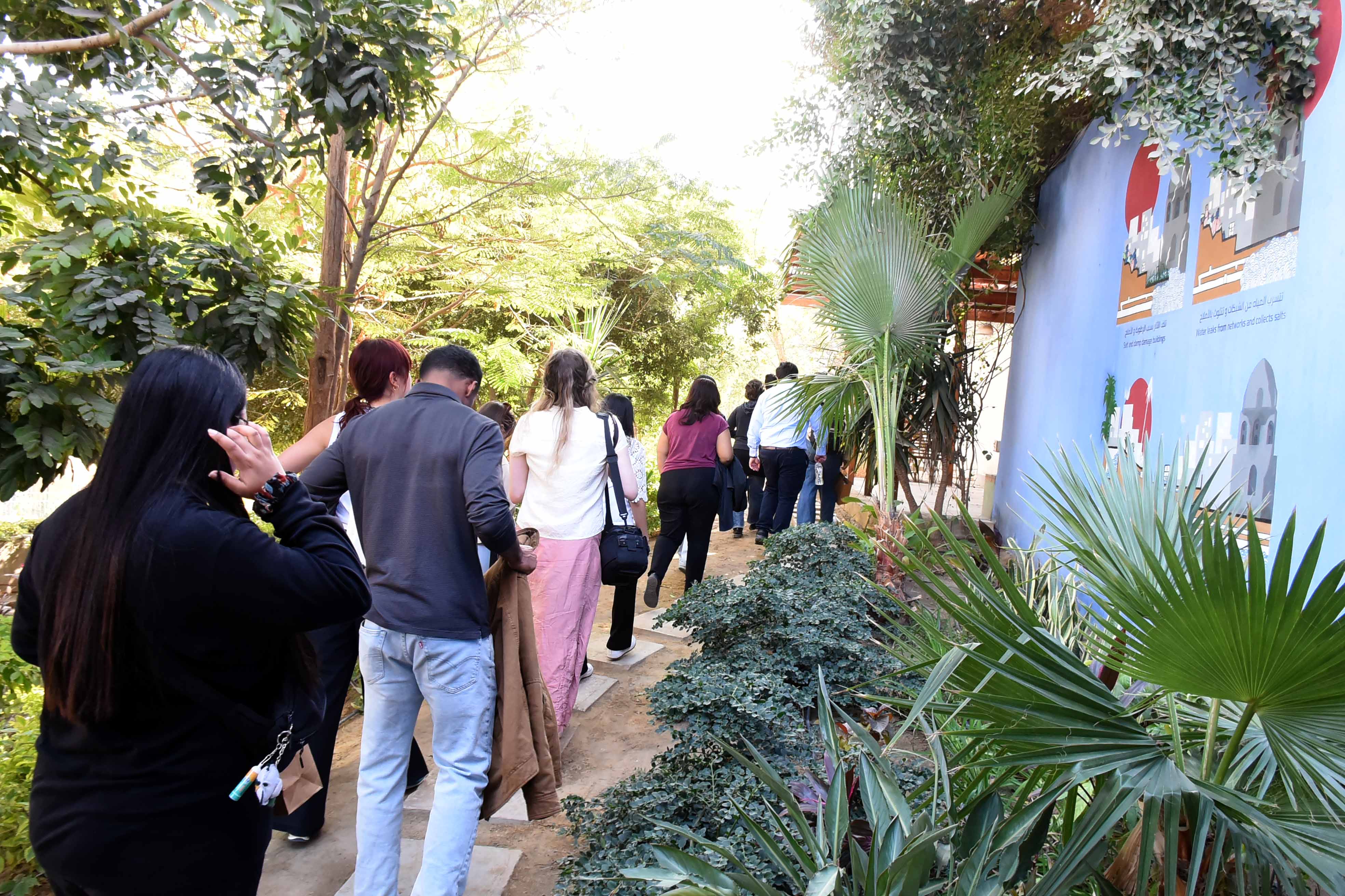 Columbia students walk through a garden