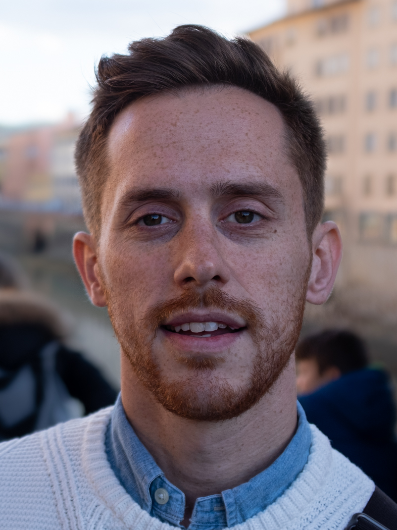 a man with orange beard and brown hair