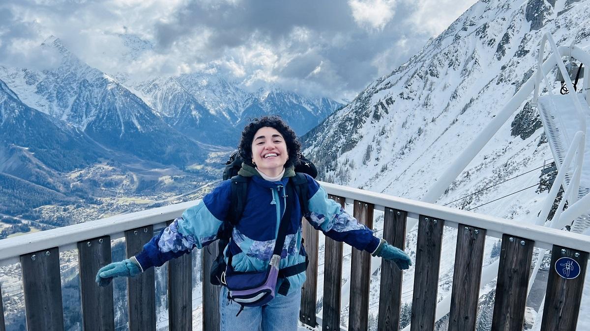 Girl on top of a mountain 