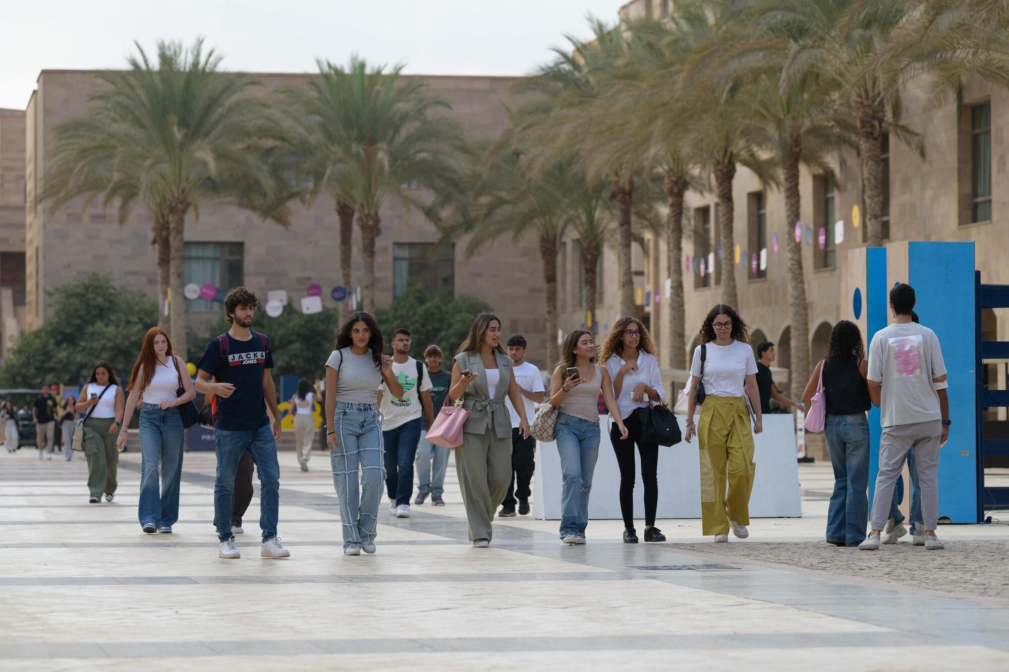 A group of students walking together on campus