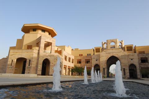 Building with a water fountain infront of it