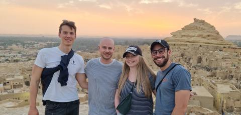 Students stand in front of Siwa