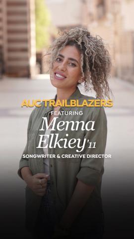 A female is tilting her head and smiling, she is wearing a light green shirt. Text: AUC Trailblazers featuring Menna El Kiey' '11. Songwriter and Creative Director