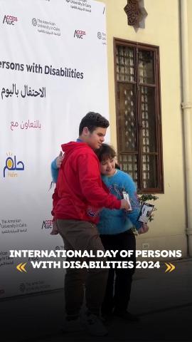 A brother and a sister are hugging each other. Text: International Day of Persons with Disabilities 2024