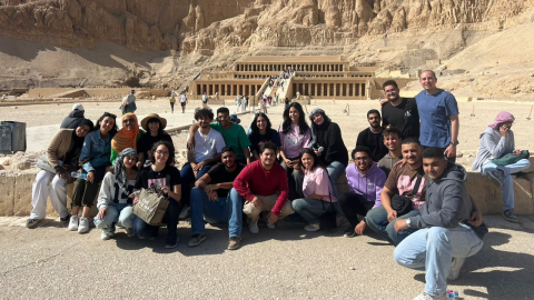 students pose in front of Luxor sites