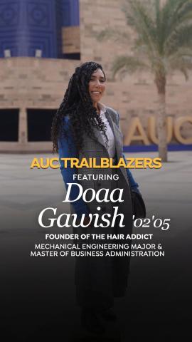 A woman is standing and smiling. Text: Trailblazer Doaa Gawish ’02, ’05, founder of the Hair Adddict