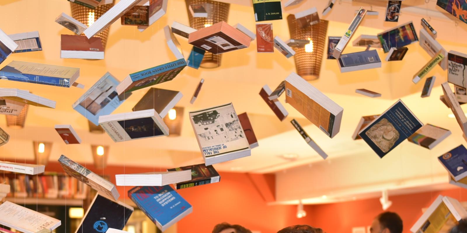 Al-Mutannabbi Street exhibition at the Rare Books and Special Collections Library in 2014 with books suspended in the air.