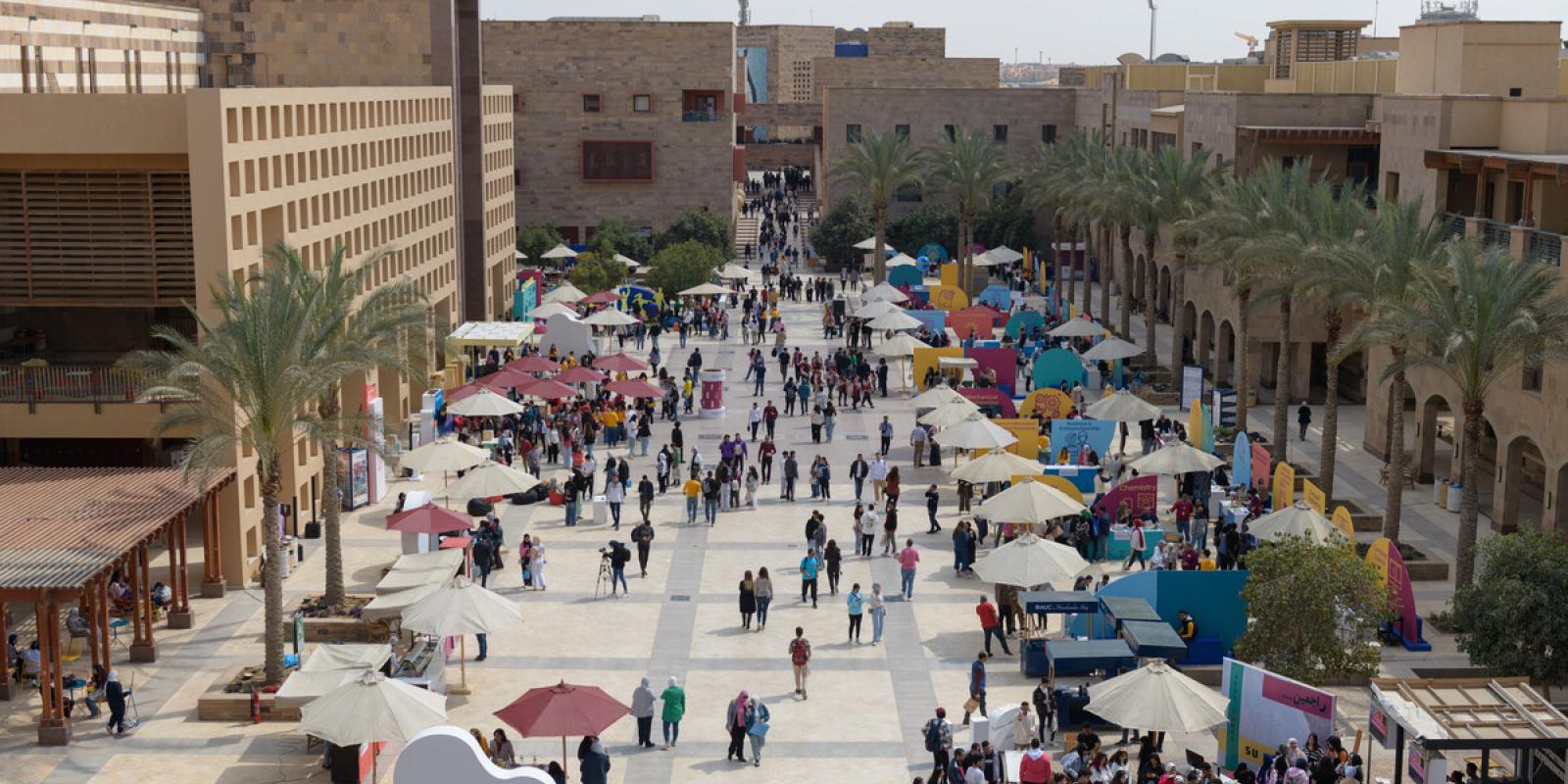 People walking in the plaza