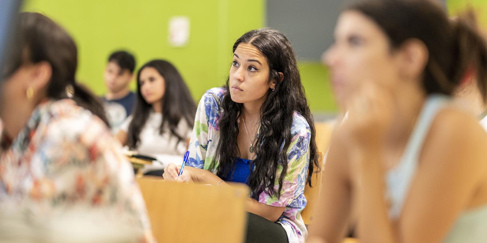 A girl in class concentrating