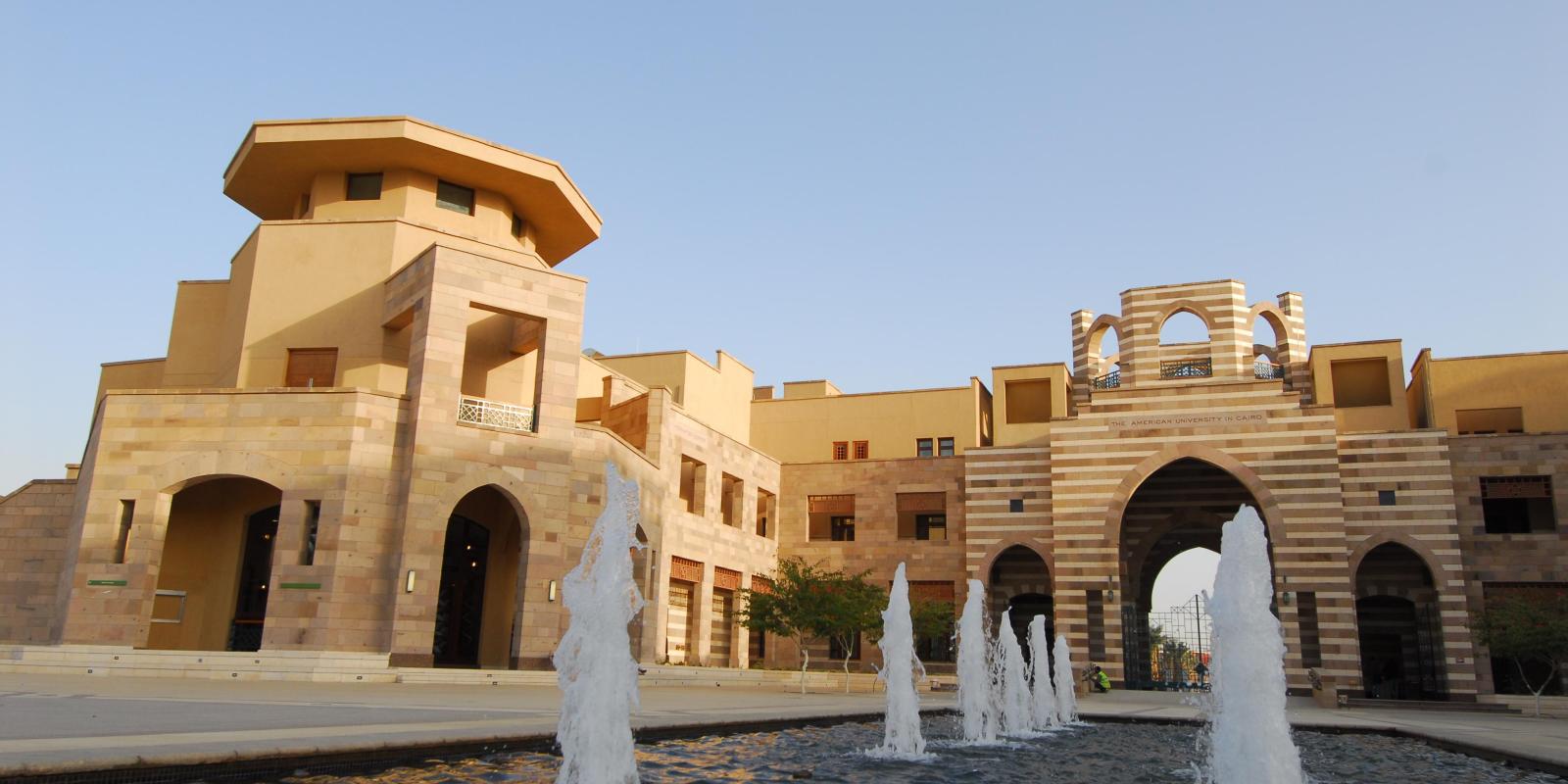 Building with a water fountain infront of it