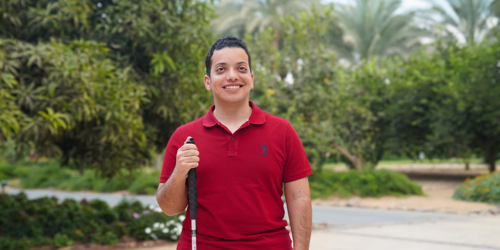 Mark Morad smiles in front of the AUC garden