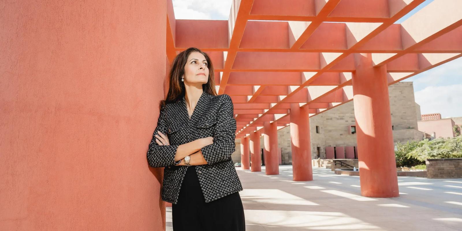 A woman is standing and looking up