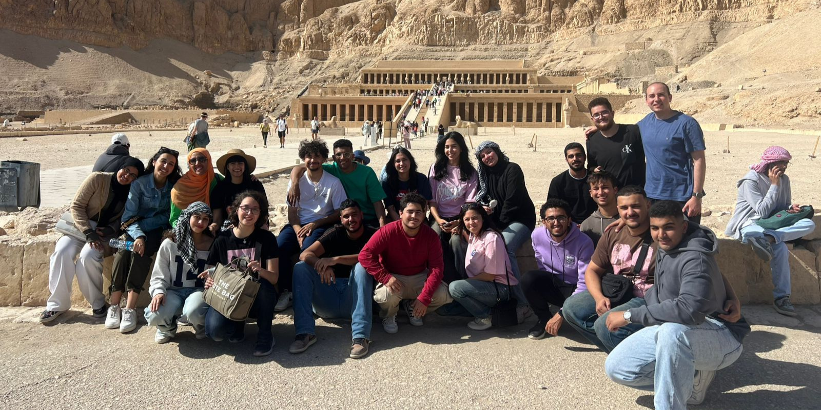 students pose in front of Luxor sites