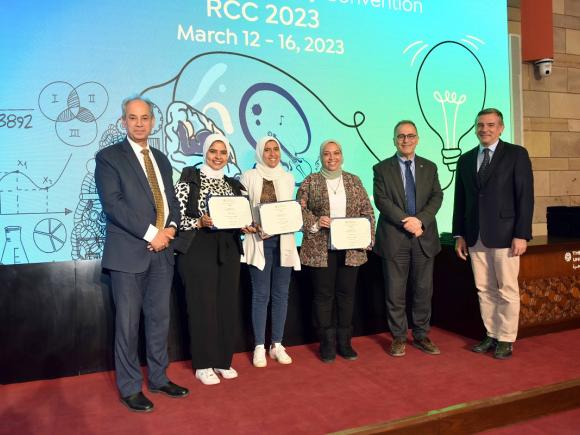 Group of people standing and holding certificates