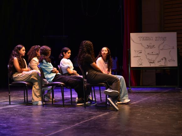 Students on stage acting