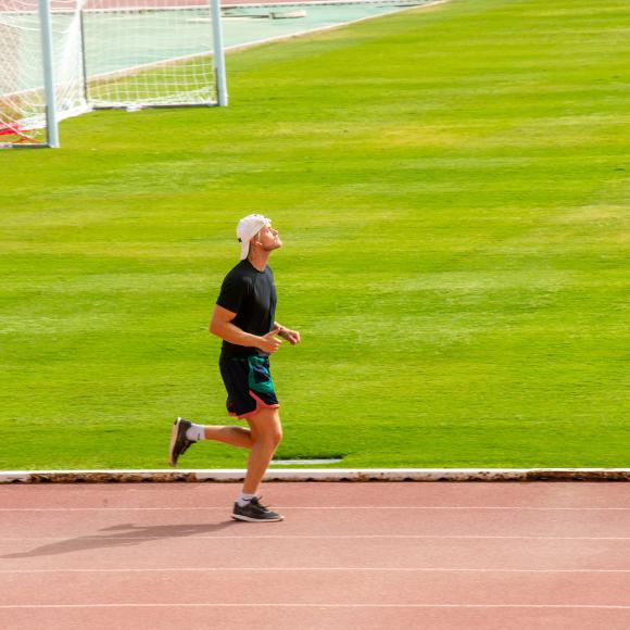 a man running in a field 